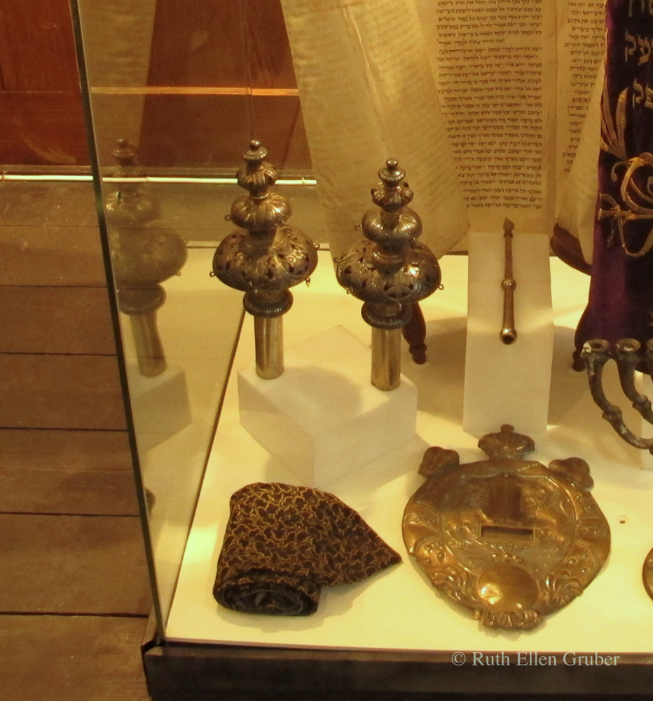 Finials that decorate the rollers of torah scrolls are called rimmonim -- pomegranates -- because of their shape